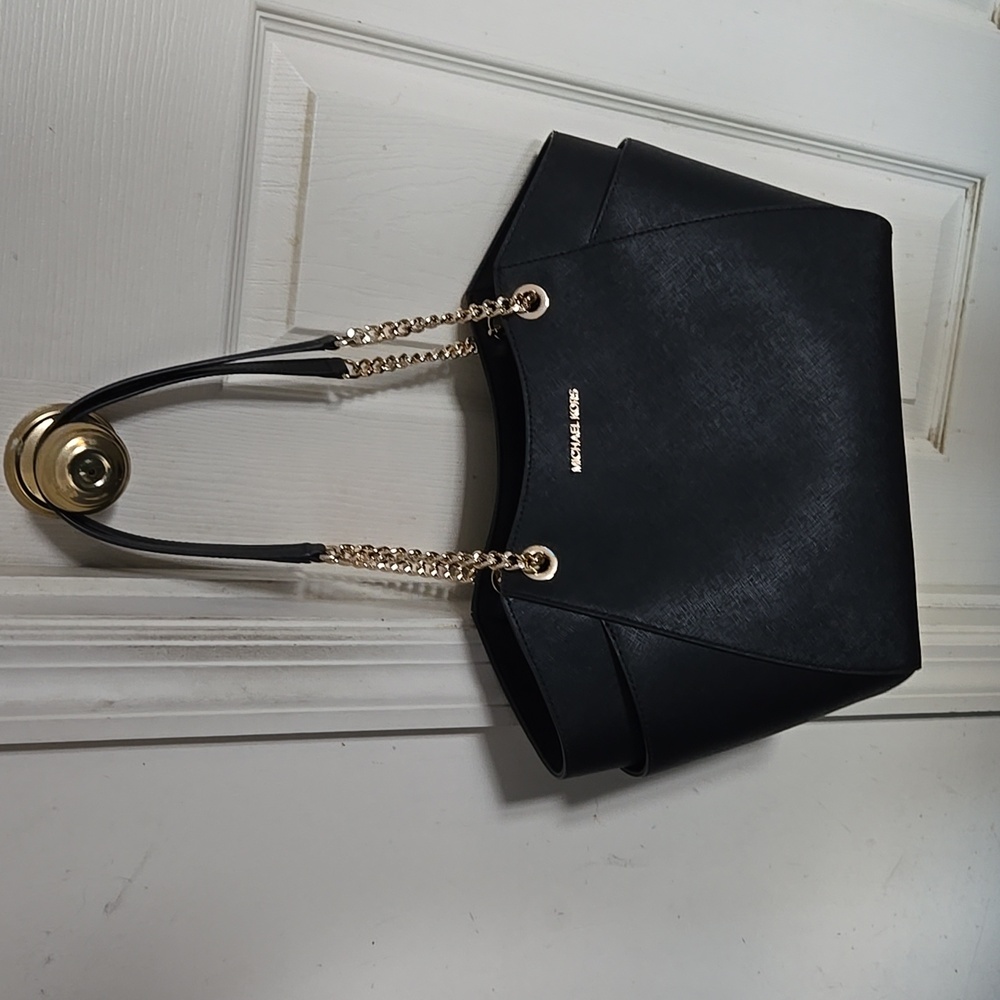 Michael Kors large purse with side pockets and gold hardware.  Michael wristlet